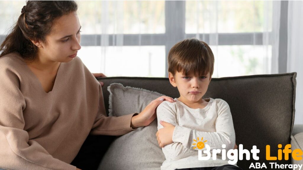 Child with autism and anxiety participating in a supportive therapy session with a therapist.